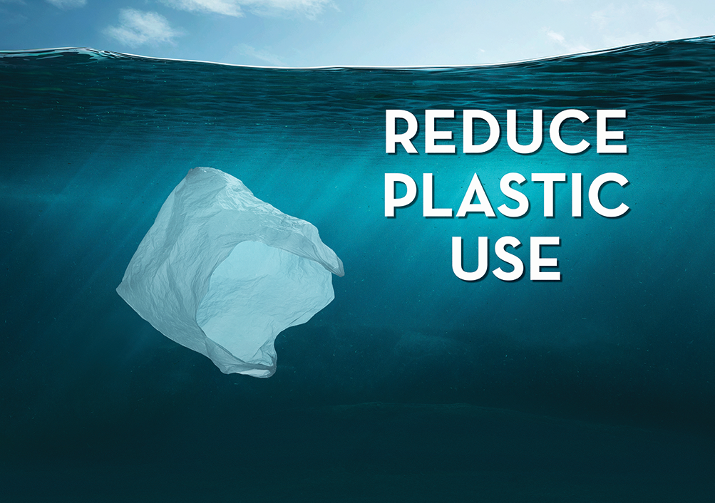 White plastic bag floating in ocean with heading Reduce Plastic Use.